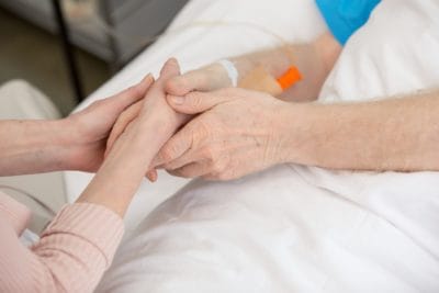 holding hands in hospital e1544197538576