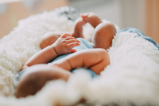 7 Tips To Help You Deal With Dry Skin In Babies 1 baby on rug e1620386279553