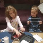 Making your money go further on a family holiday making your money go further on a family holiday - kids playing yatzee