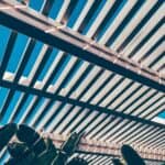 Bioclimatic Pergolas: Style, Practicality, and Weather-Ready Design Stripped image of a wooden roof in a terrace