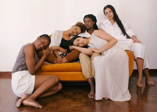 Anxious Parenting: How To Deal With Anxiety As A Stressed-Out Single Mum 5 Tired mother on a couch surrounded by friends hugging her