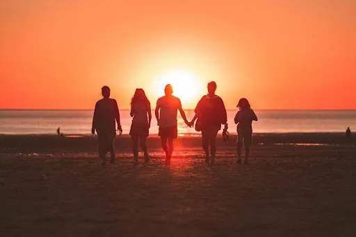 family watching sunset