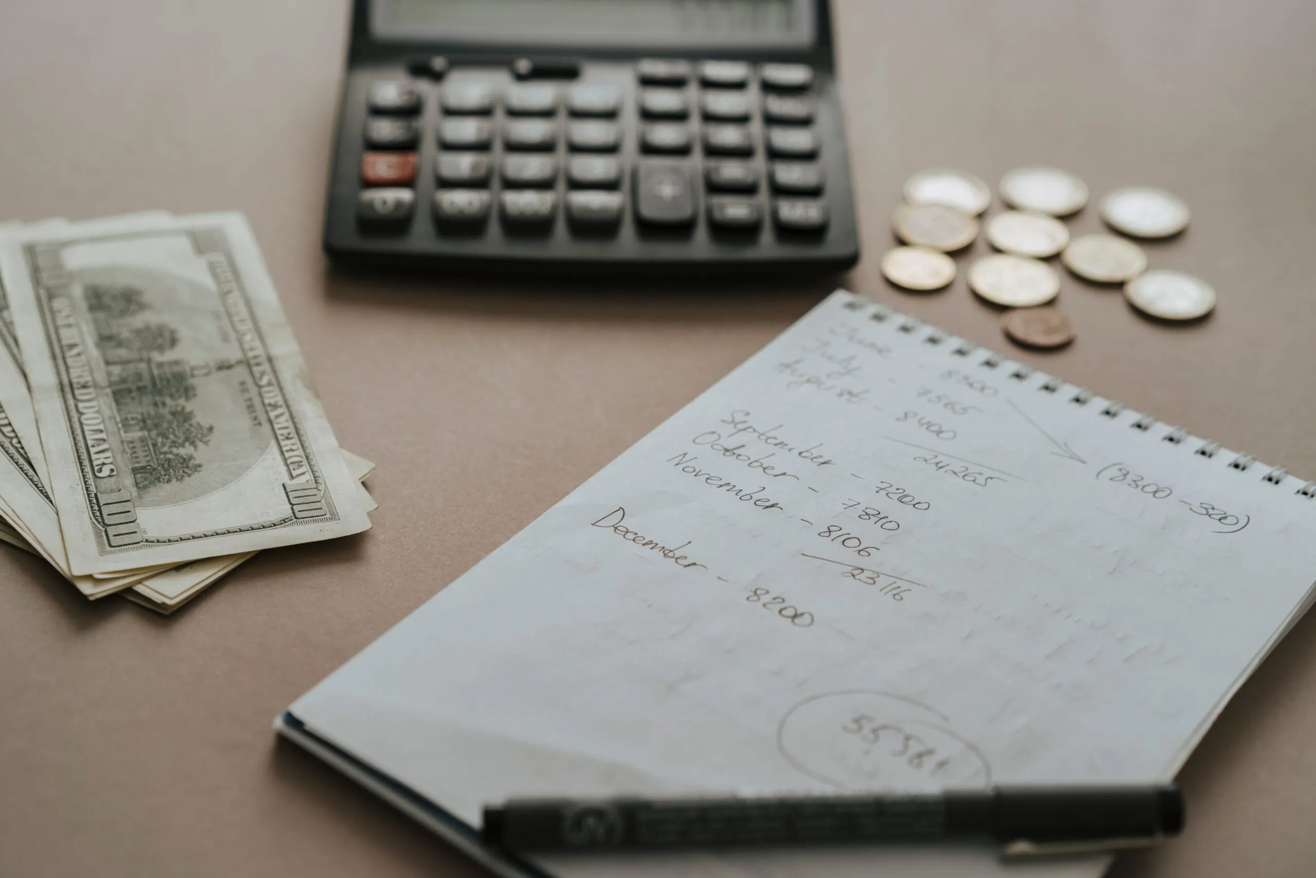 How to Budget for Plastic Surgery Without Financial Stress 1 notebook and calculator scaled